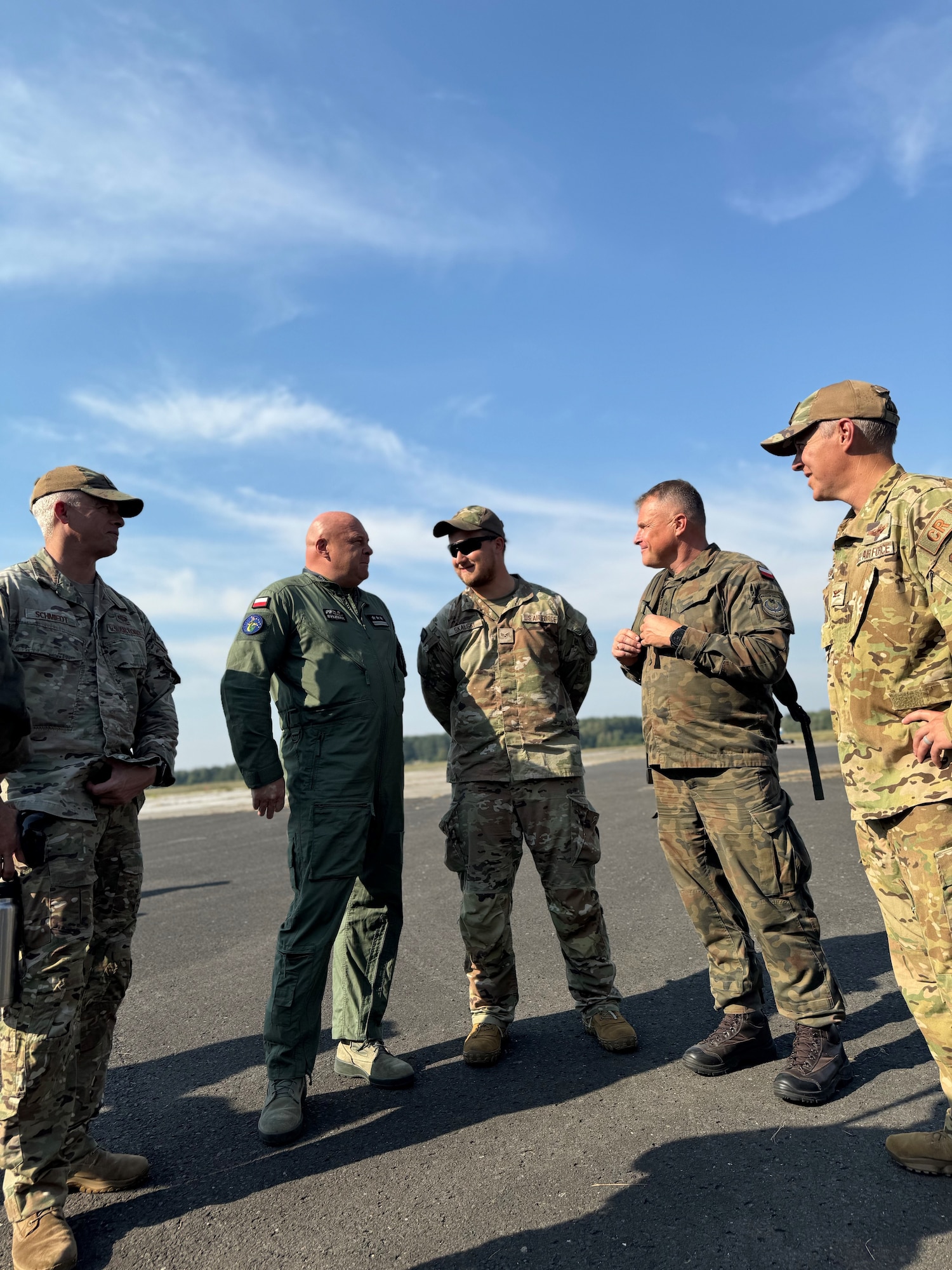 U.S. Airmen from the 435th Air Ground Operations Wing and 435th Contingency Response Group and their Polish Air Force counterparts gather in a group meeting during exercise Agile Bison 2024 at Koszalin, Poland, Sept. 18, 2024. The exercise was a bilateral training event designed to enhance interoperability, maintain joint readiness, and strengthen rapid response capabilities between U.S. and Polish air forces. (Courtesy photo)