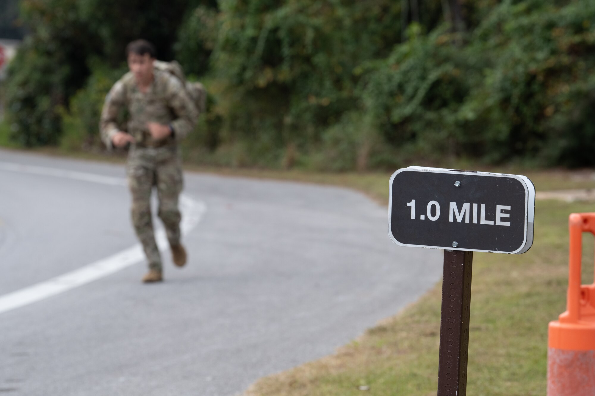 A U.S. Air Commando, a contestant of the Service Member of the Year competition, runs a 3-mile ruck at Hurlburt Field, Florida, Oct. 30, 2024.