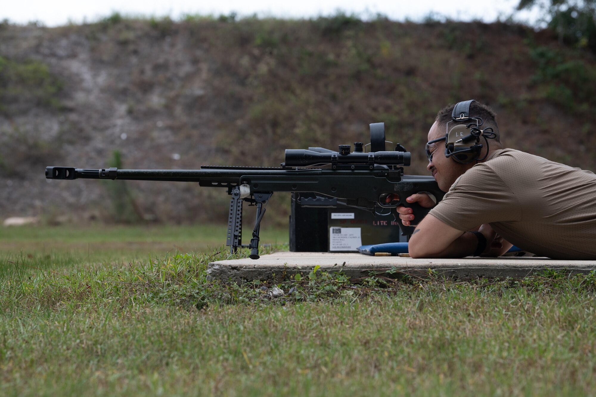 A U.S. Air Commando, a contestant of the Service Member of the Year competition, aims a L96A1 sniper rifle at a target at Hurlburt Field, Florida, Oct. 29, 2024.