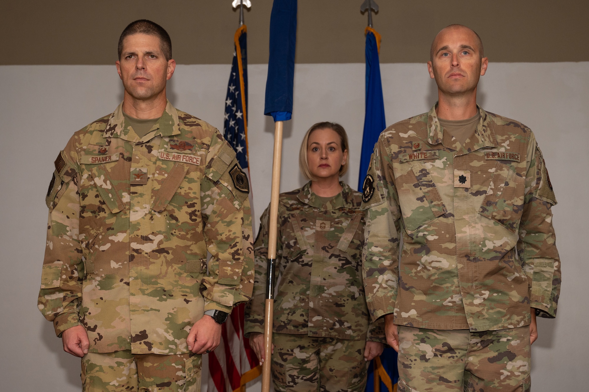 U.S. Air Force Col. Seth Spanier, 7th Bomb Wing commander, and Lt. Col. Nathaniel White, 21st Combat Air Base Squadron commander, stand at attention during the 21st CABS assumption of command at Dyess Air Force Base, Texas, Nov. 7, 2024. Integrating with the 21st Air Task Force, the 21st CABS will be part of the pilot program. The 21st CABS will serve as the 21st ATF’s primary base operations support element. (U.S. Air Force photo by Airman 1st Class Emma Anderson)