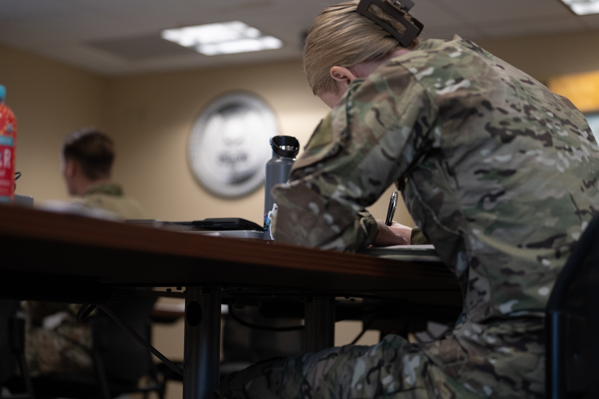 A U.S. Air Commando, a contestant for the Service Member of the Year competition, takes notes during a training for an upcoming test at Hurlburt Field, Florida, Oct. 28, 2024.
