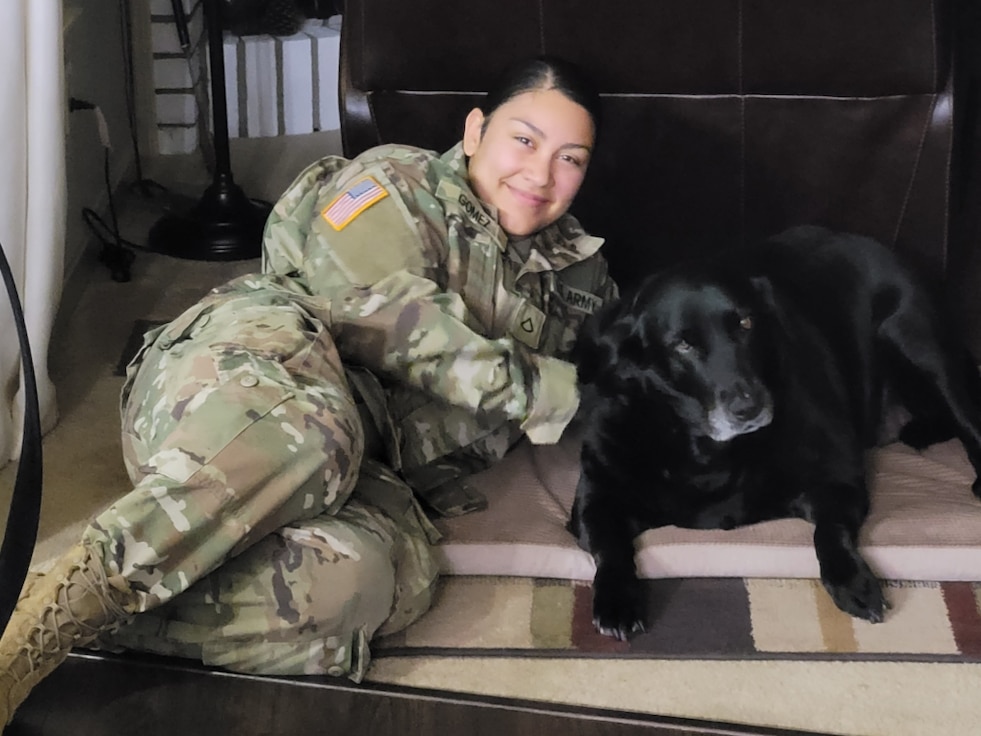 Spc. Mariel Gomez poses with her dog. (Courtesy photo)