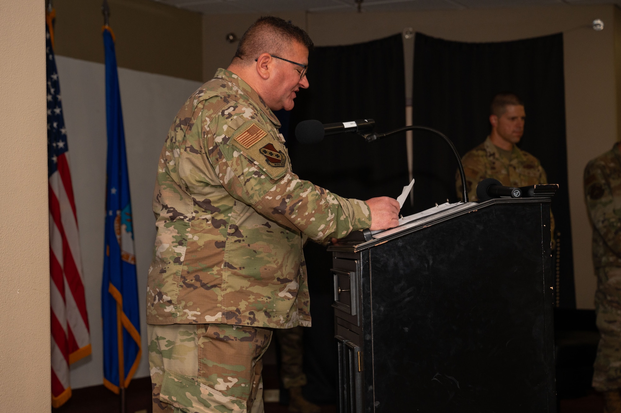 U.S. Air Force Maj. Kenneth Valardi, 7th Bomb Wing deputy wing chaplain, speaks at the 21st Combat Air Base Squadron assumption of command ceremony at Dyess Air Force Base, Texas, Nov. 11, 2024. The 21st CABS will shape the future development of Airmen, the Air Force’s ability to project forces, and shape strategic planning for the nation. (U.S. Air Force photo by Airman 1st Class Emma Anderson)