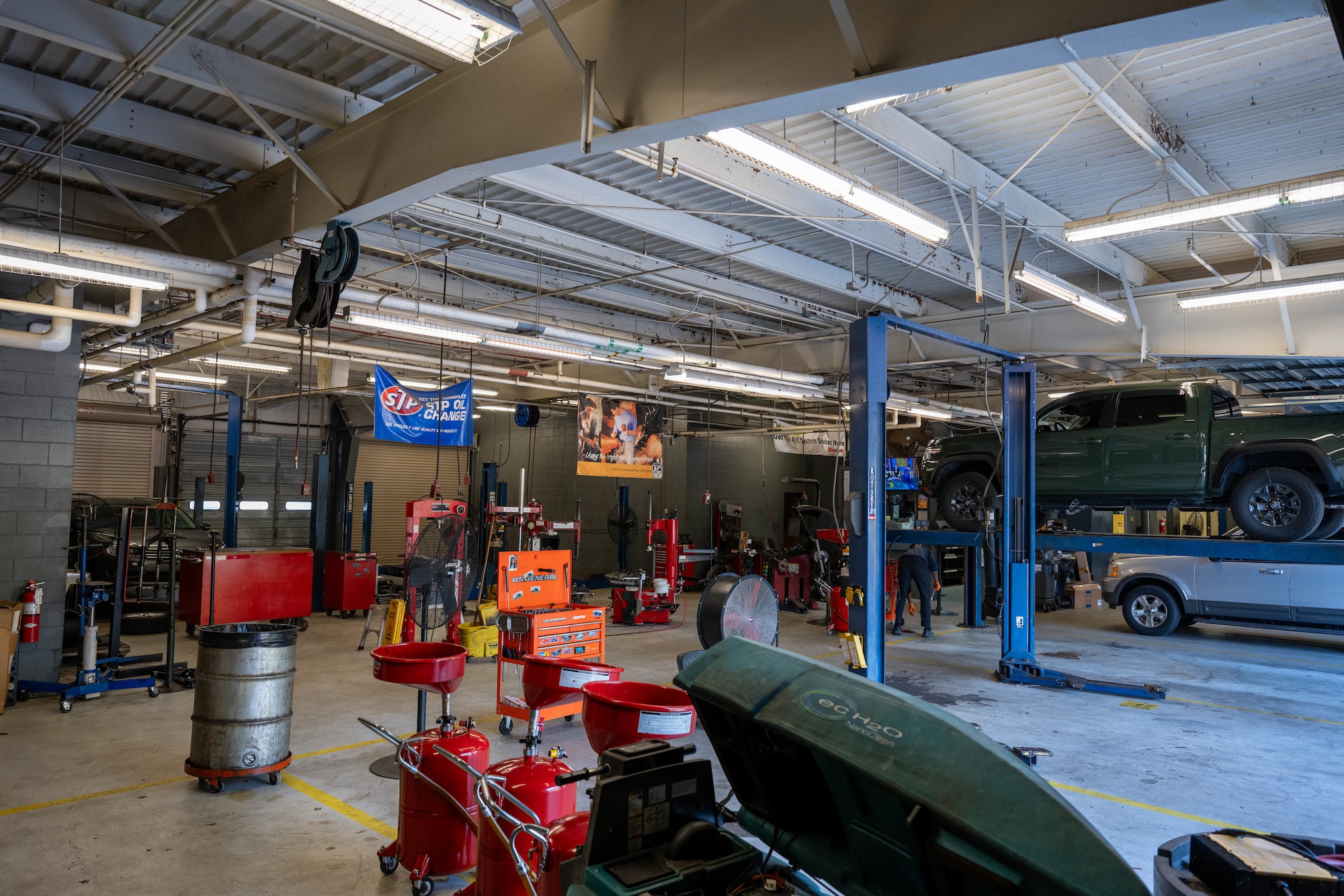 Employees open the self-help bays for the day at the Auto Hobby Shop at Hurlburt Field, Florida, Oct. 29, 2024.