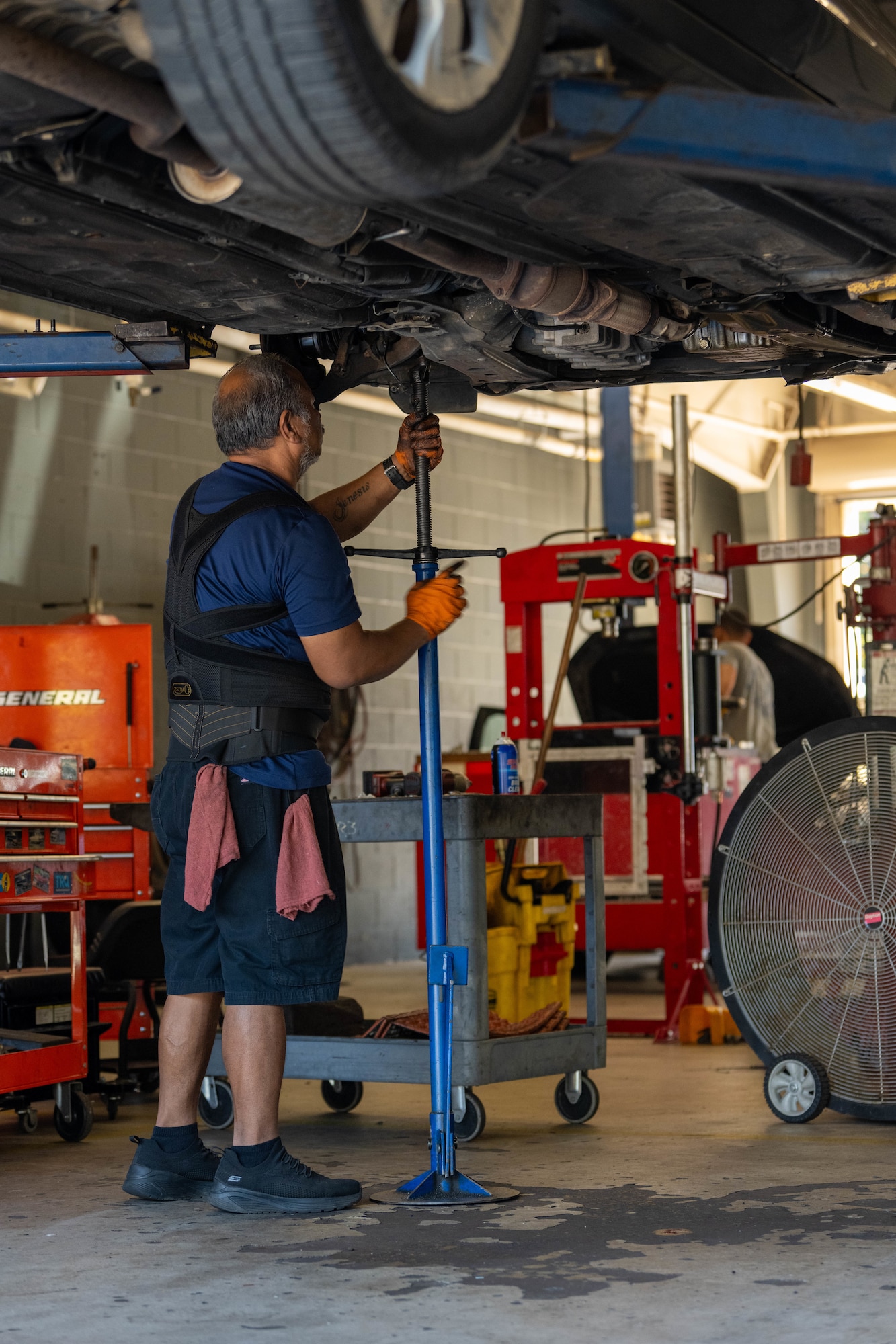Jay Quitugua, 1st Special Operations Force Support Squadron Auto Hobby automotive mechanic, turns a high-lift floor jack at Hurlburt Field, Florida, Oct. 29, 2024.