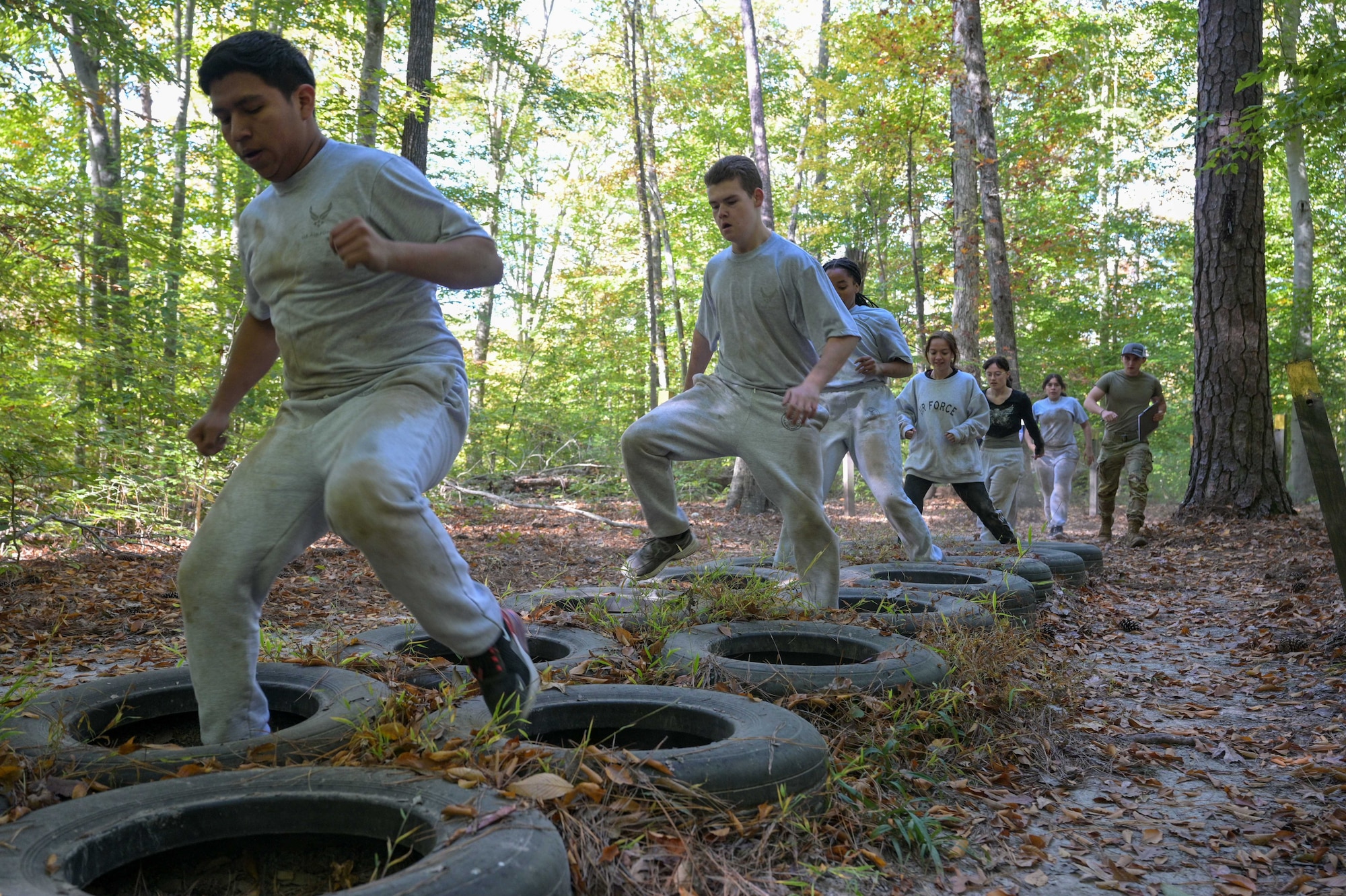 Cadets jump through tires.