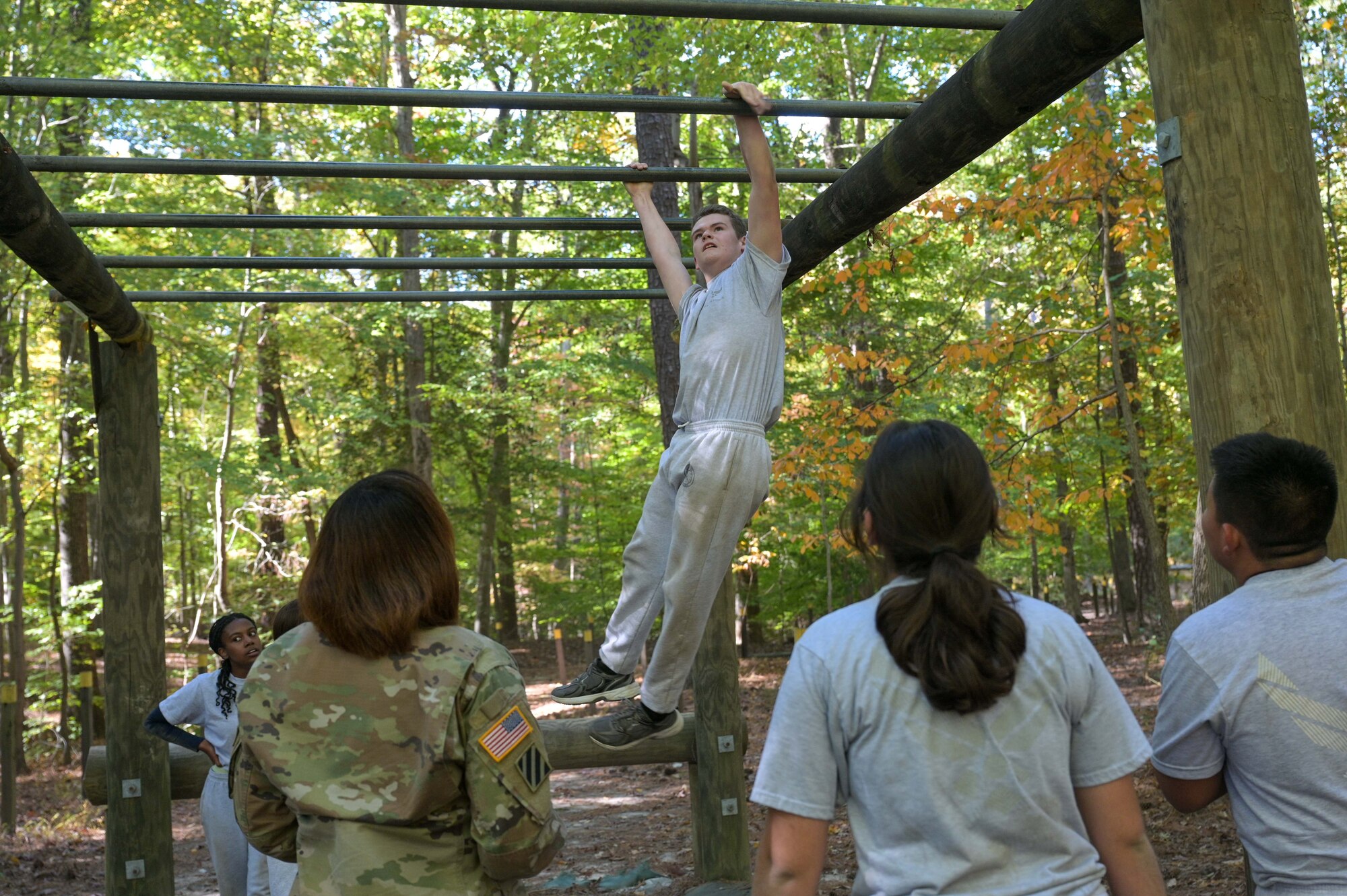 Girl on monkey bars.