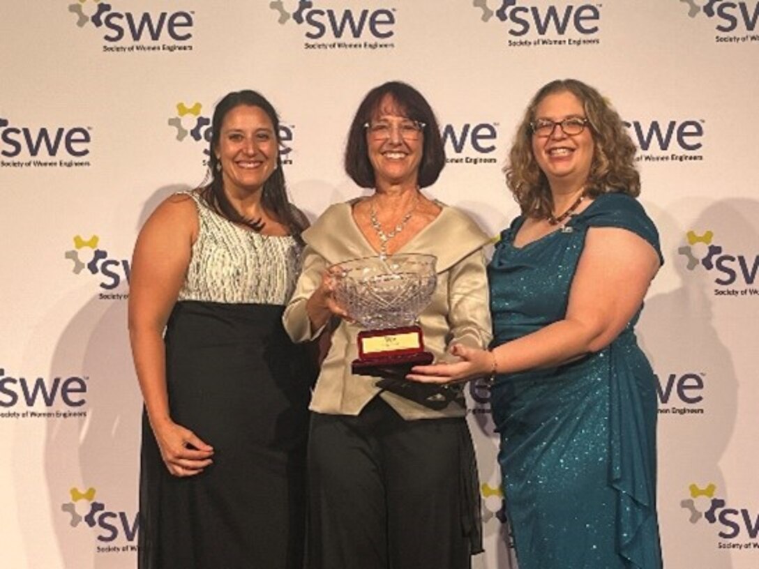 NSWC Crane employee Ashley Durcholz (left) and Lori Zipes pictured with Karen Roth (right), an Air Force civilian and SWE President.