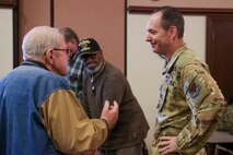 U.S. Air Force Lt. Col. Nathan Maertins, 9th Reconnaissance Wing chief of staff, talks to a veteran retiree at Beale’s annual Retiree Appreciation Day at Beale Air Force Base, Nov. 7, 2024.