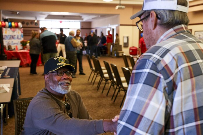 U.S. Army retired Sgt. Donald Owens, Beale Retiree Office volunteer, greets attendees of Beale’s Retiree Appreciation Day 2024 at Beale Air Force Base, Nov. 7, 2024.