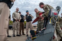 U.S. Air Force Airmen from the 9th Maintenance Squadron provide an ejection seat demonstration for California Highway Patrol (CHP) officers on Beale Air Force Base, California, Oct. 30, 2024.