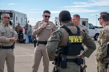 U.S. Air Force Airmen from the 9th Security Forces Squadron talk with Auburn California Highway Patrol (CHP) officers on Beale Air Force Base, California, Oct. 30, 2024.