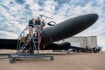 U.S. Air Force Staff Sgt. Braydon Campbell, 9th Aircraft Maintenance Squadron U-2 dedicated crew chief, shows the inside of a U-2 Dragon Lady cockpit to two Auburn California Highway Patrol (CHP) officers on Beale Air Force Base, California, Oct. 30, 2024.