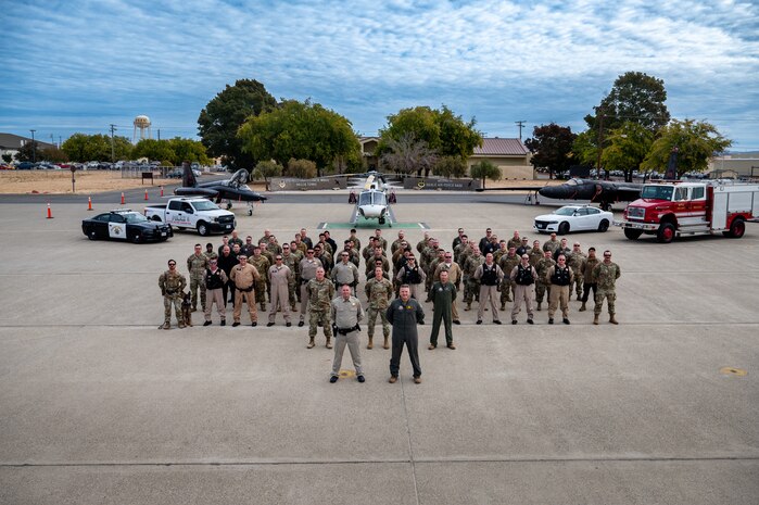 U.S. Air Force Airmen from the 9th Reconnaissance Wing pose with members of the Auburn California Highway Patrol (CHP) on Beale Air Force Base, California, Oct. 30, 2024.