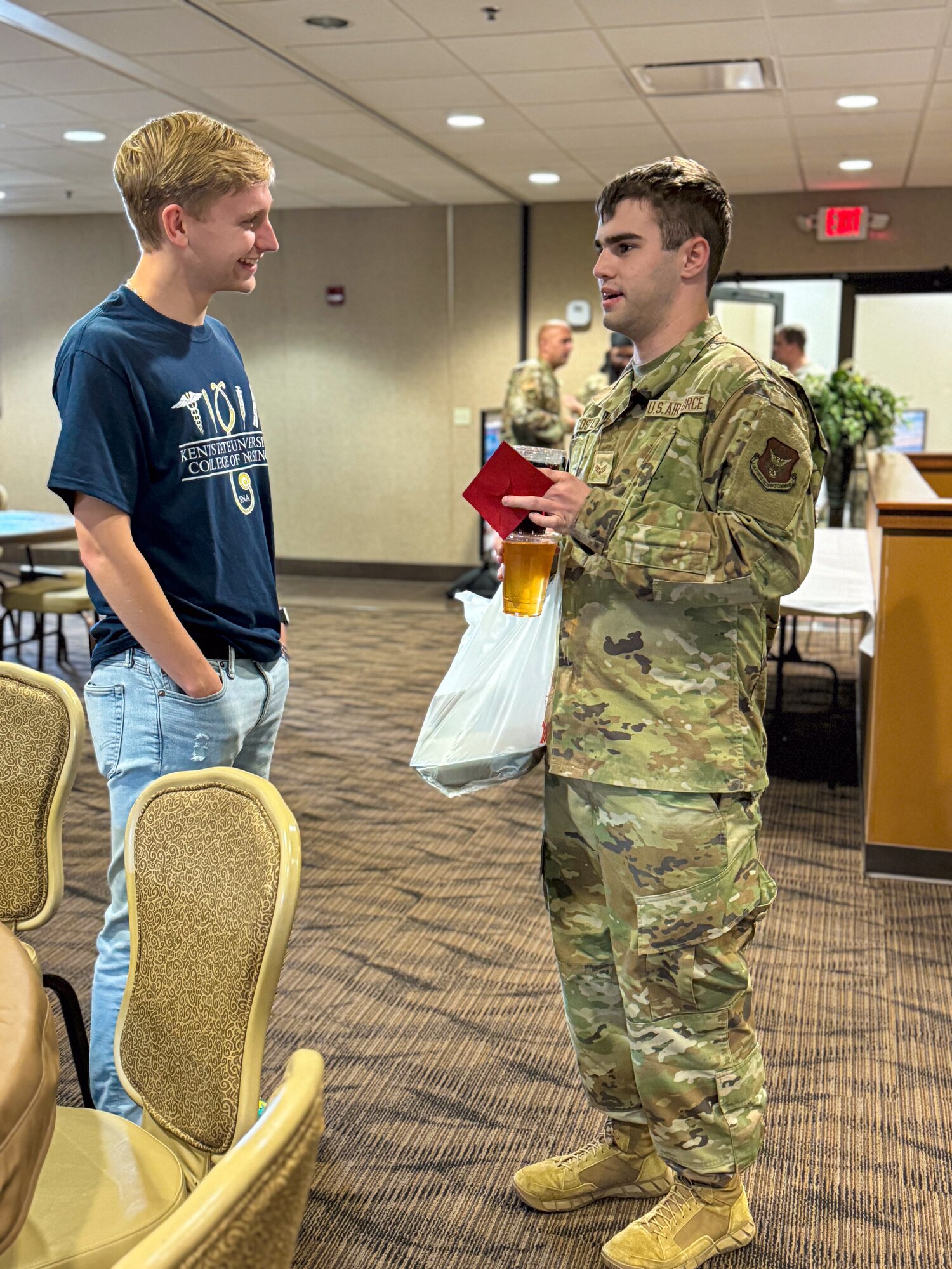 A Citizen Airman from the 910th Airlift Wing talks with a nursing student from Kent State University Trumbull campus at Youngstown Air Reserve Station, Nov. 2, 2024.