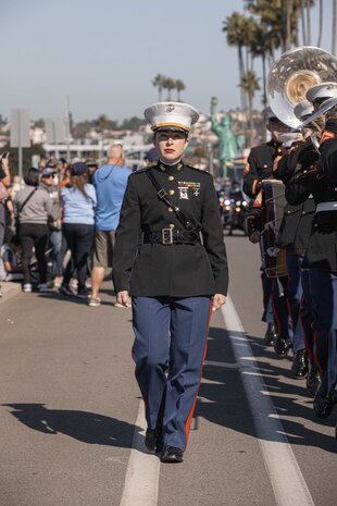 U.S. Marines Corps Warrant Officer Megan E. Harper, band officer, Marine Band San Diego, marches in the San Diego Veterans Day Parade in San Diego, California, Nov. 11, 2024. The Marine Band San Diego’s job is to support the Recruit Training Regiment and other depot organizations. Marine Band San Diego performs a wide variety of music at military ceremonies and civilian events throughout San Diego County and the southwestern United States. (U.S. Marine Corps photo by Cpl. Alexandra M. Earl)