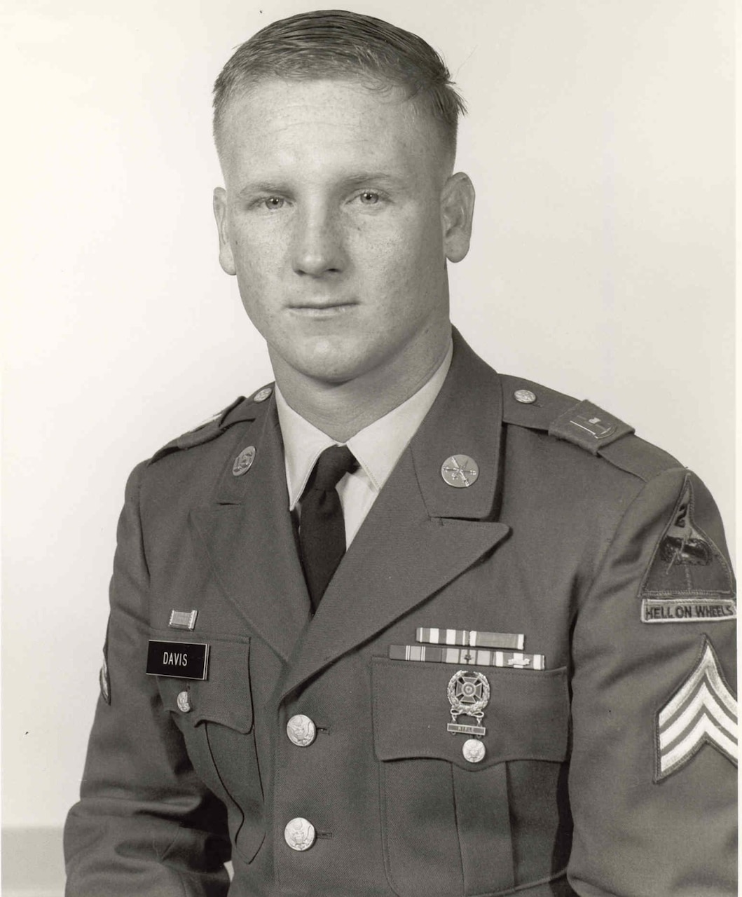 A man in uniform poses for a photo.