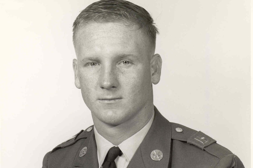 A man in uniform poses for a photo.