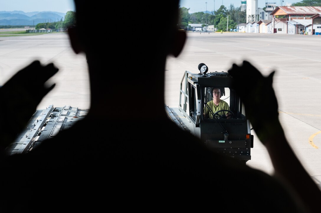 U.S. Airmen unload cargo from a C-5M Super Galaxy from Dover Air Force Base, Delaware, at Soto Cano Air Base, Honduras, Nov. 8, 2024.