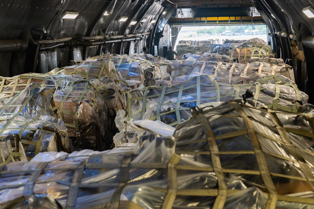 U.S. Airmen unload cargo from a C-5M Super Galaxy from Dover Air Force Base, Delaware, at Soto Cano Air Base, Honduras, Nov. 8, 2024.