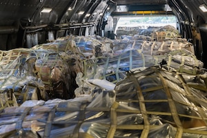 U.S. Airmen unload cargo from a C-5M Super Galaxy from Dover Air Force Base, Delaware, at Soto Cano Air Base, Honduras, Nov. 8, 2024.