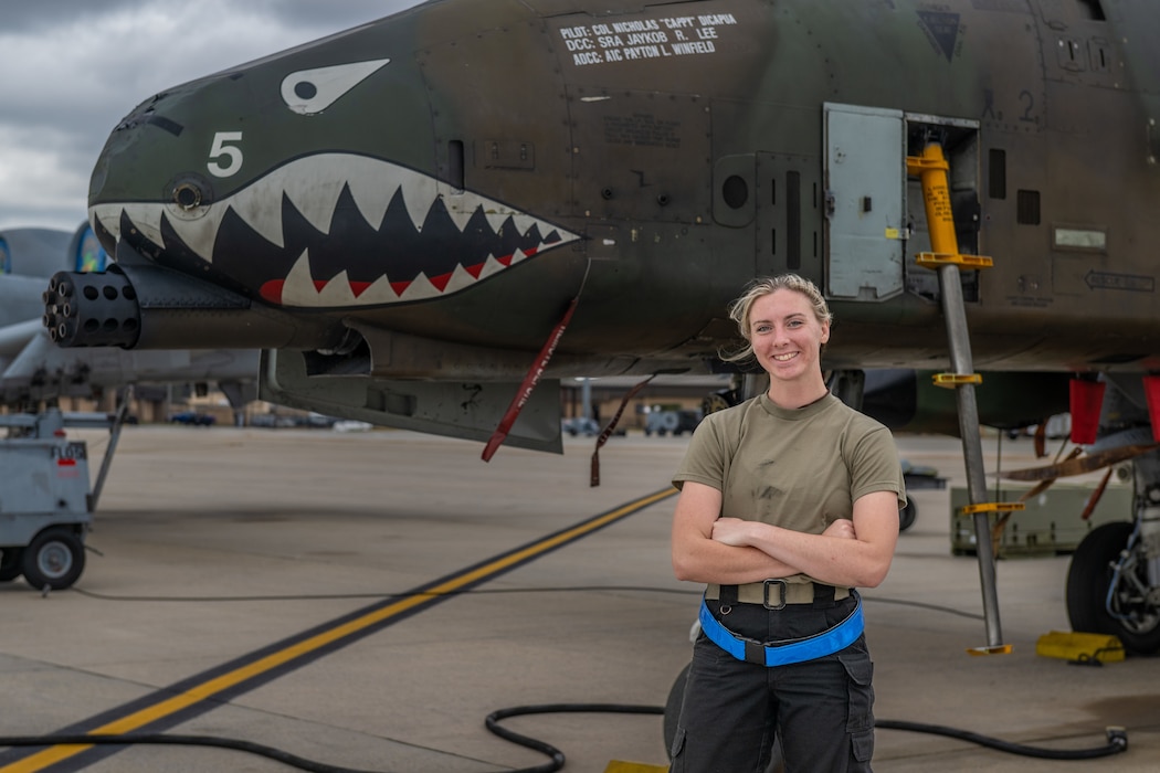 person standing in front of a plane