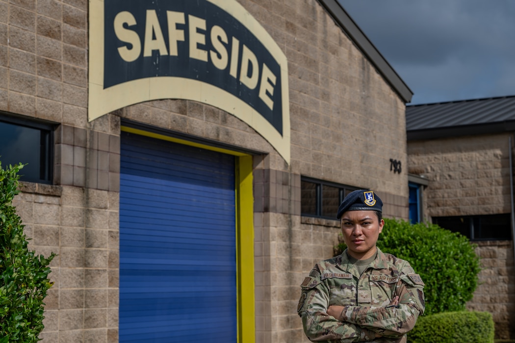 person standing in front of a building