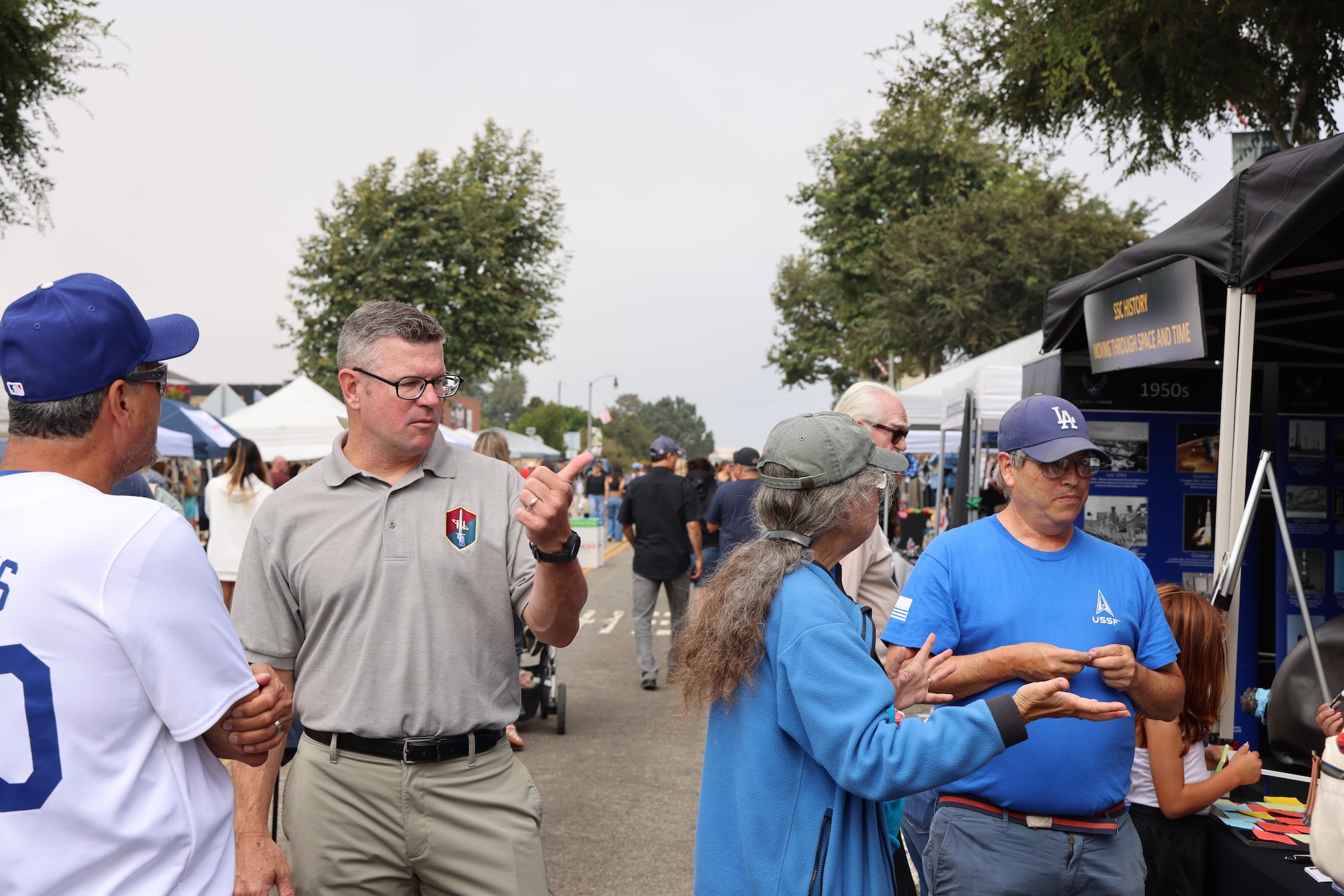 Col. Andrew Dermanoski, Commander, Space Base Delta 3, speaks with community members at the El Segundo Main Street Fair on Sept. 28, 2024, in El Segundo, Calif. The Main Street Fair is an annual event that celebrates vendors and local business of the El Segundo area.