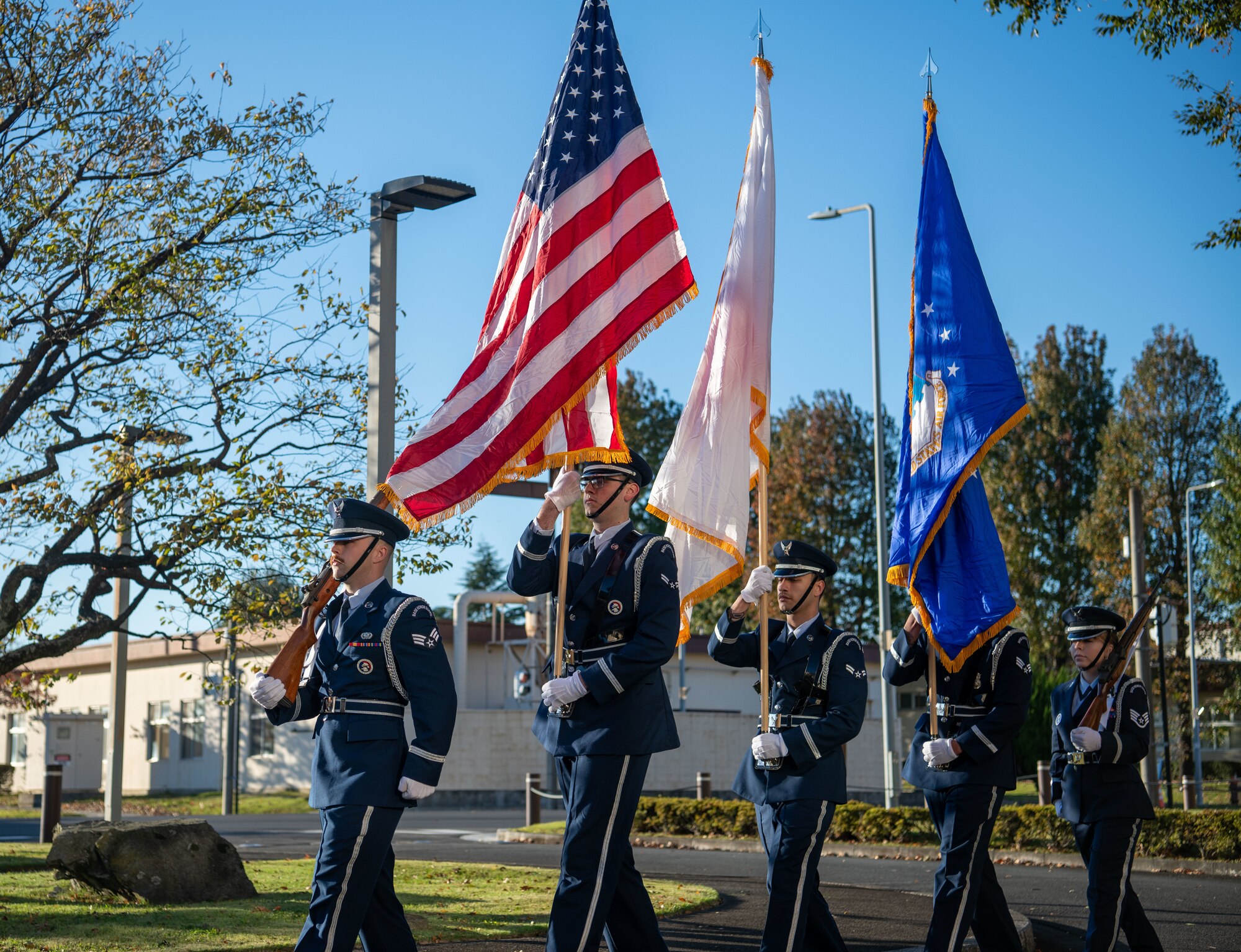 Honor guardsmen prepare to present colors during a Veterans Day ceremony at Yokota.