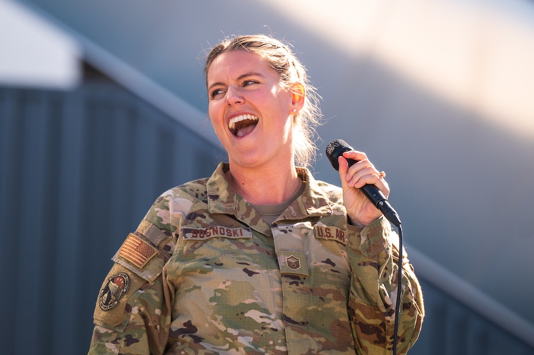 U.S. Air Force Tech. Sgt. Nadia Sosnoski, Max Impact ensemble member, sings during a performance as a part of the NASCAR Championship pre-race events November 10, 2024, at Phoenix Raceway in Avondale, Arizona.