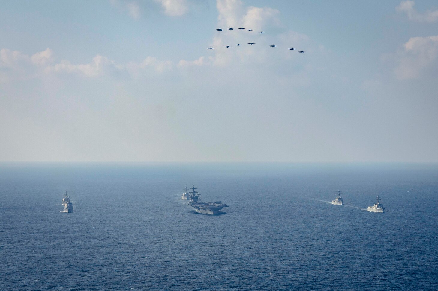 Nimitz-class aircraft carrier USS George Washington (CVN 73), Arleigh Burke-class guided-missile destroyers USS Higgins (DDG 76), USS McCampbell (DDG 85) and USS Dewey (DDG 105), Japan Maritime Self-Defense Force Maya-class guided-missile destroyer JS Haguro (DDH 180), Republic of Korea Navy Chungmugong Yi Sun-sin-class destroyer ROKS Chungmugong Yi Sun-sin (DDH 975), and Sejong the Great-class destroyer ROKS Seoae Ryu Seong-ryong (DDG 993) steam in formation as aircraft assigned to Carrier Air Wing 5, U.S. Air Force, Japan Air Self-Defense Force, and Republic of Korea Air Force fly over the formation during Freedom Edge 24-2 in the East China Sea, Nov. 13. Freedom Edge demonstrates a new era of trilateral cooperation to ensure peace and stability in the Korean Peninsula and the Indo-Pacific. George Washington is 7th Fleet’s premier forward-deployed aircraft carrier, a long-standing symbol of the United States’ commitment to maintaining a free and open Indo-Pacific region, while operating alongside allies and partners across the U.S. Navy’s largest numbered fleet. (U.S. Navy photo by Mass Communication Specialist 1st Class Markus Castaneda)