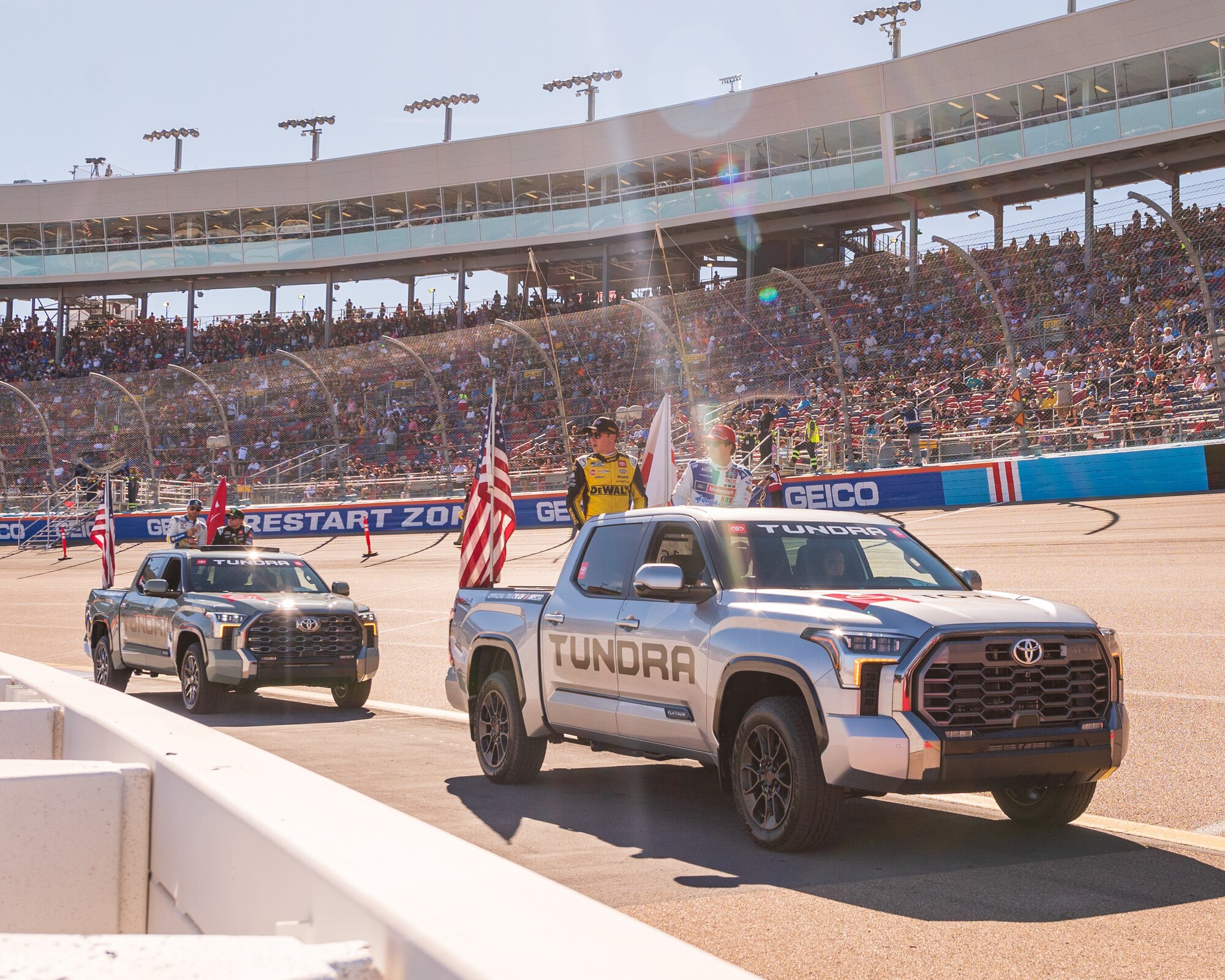 56th Fighter Wing Airmen drive NASCAR racecar drivers as a part of a parade during the NASCAR Championship pre-race events November 10, 2024, at Phoenix Raceway in Avondale, Arizona.