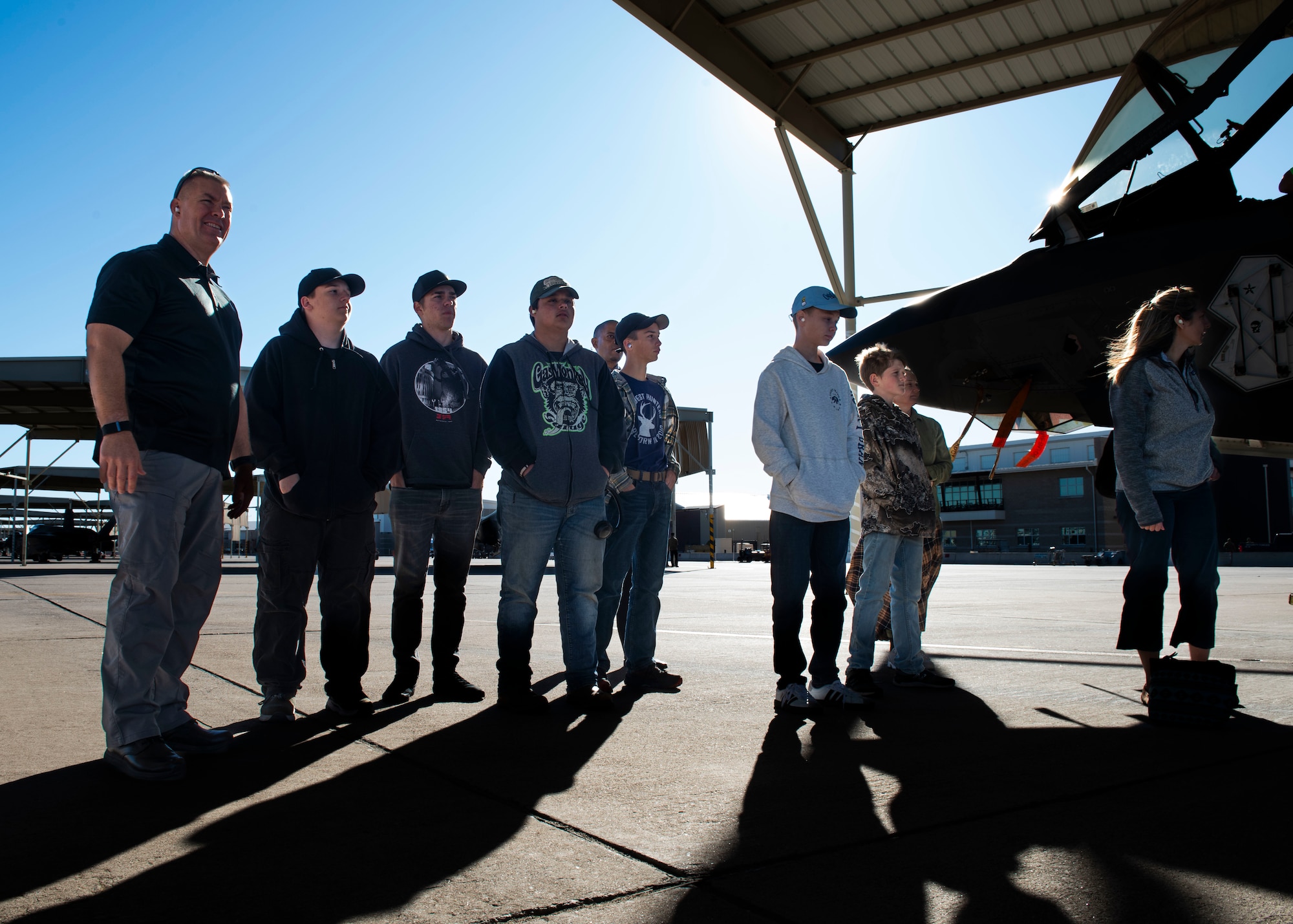 Retired U.S. Air Force Maj. Gen. Brook Leonard, prior 56th Fighter Wing commander (2016-2018), and a group of homeschooled students from the local area tour the flightline, Nov. 7, 2024, at Luke Air Force Base, Arizona.