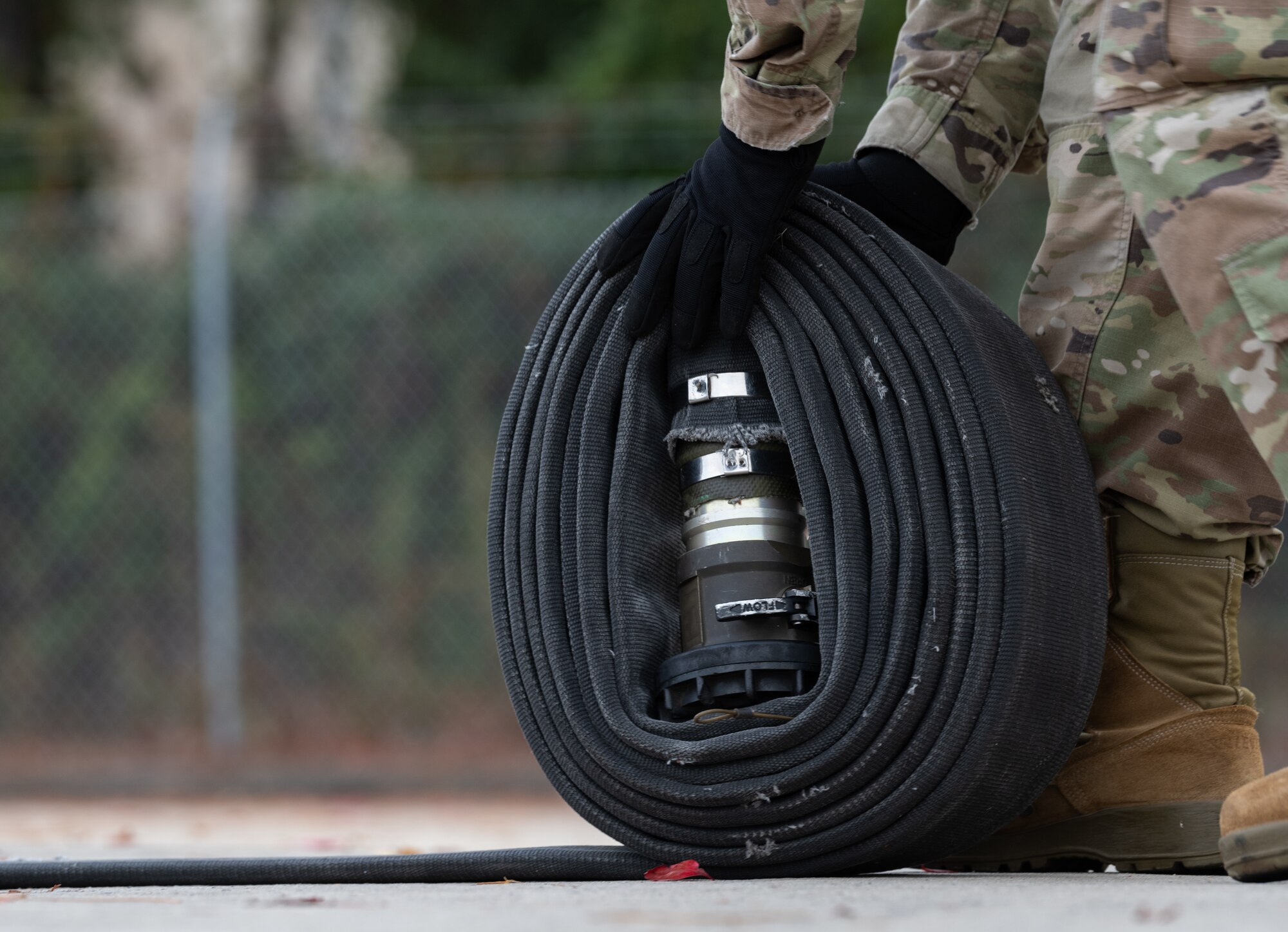 A fueling hose is rolled up during a Forward Area Refueling Point tryout at Hurlburt Field, Florida, Oct. 31, 2024.