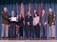 Lieutenant General William H. Graham (far left), 56th Chief of Engineers and Commanding General, U.S. Army Corps of Engineers and Command Sergeant Major Douglas Galick (far right), 15th Command Sergeant Major, USACE present (left to right) Brad Scully, Lise Ditzel-Ma, Gerald Young, Jodi Yoshishige, and David Matsumoto the 2024 USACE Project Delivery Team of the Year Award at the 2024 USACE National Award Ceremony in Washington, DC Nov. 13, 2024. This was to commemorate the PDT’s work on the Command and Control Facility Project on Fort Shafter, Hawaii, which is the new U.S. Army Pacific Headquarters building now named the Frederick C. Weyand Command Center. (Photo courtesy of USACE HQ).