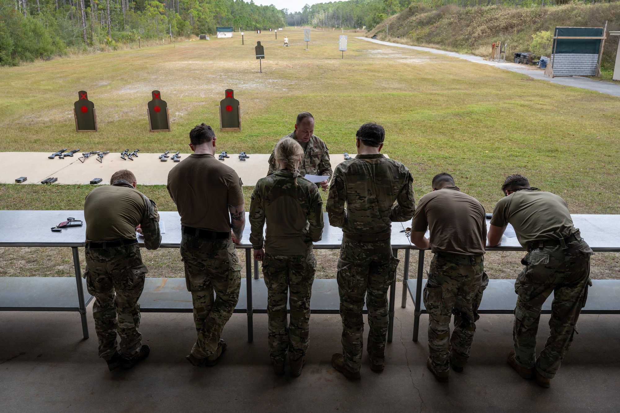A U.S. Air Commando weapons instructor briefs participants during the Service Member of the Year competition at Hurlburt Field, Florida, Oct. 30, 2024.