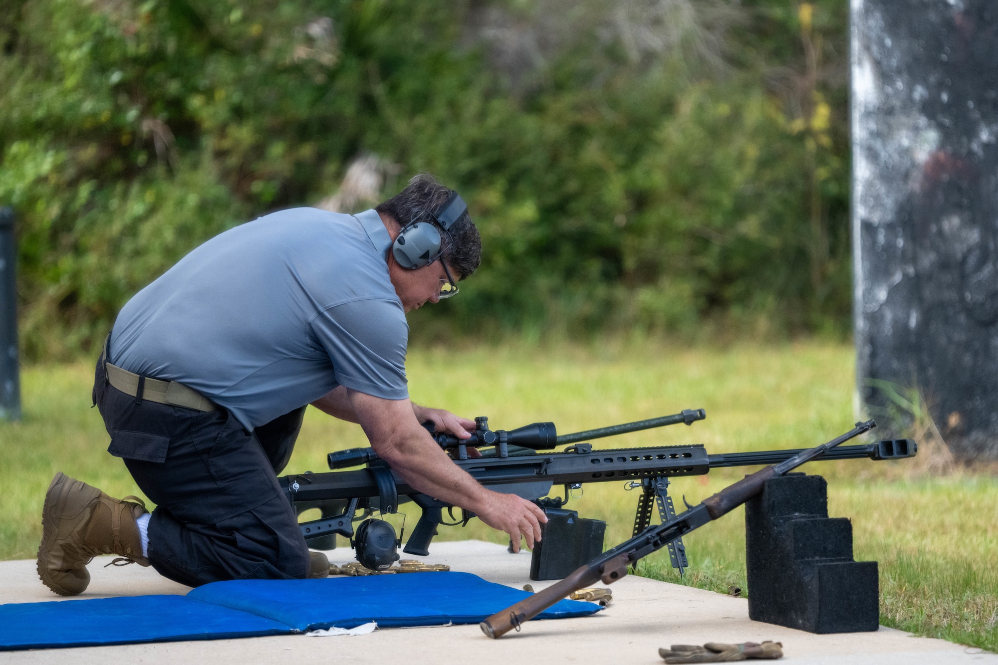 A senior range safety officer prepares a M107 .50-caliber Barrett Rifle for participants of the Service Member of the Year competition at Hurlburt Field, Florida, Oct. 30, 2024.