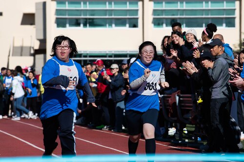 Athletes participate in the 50-meter dash.