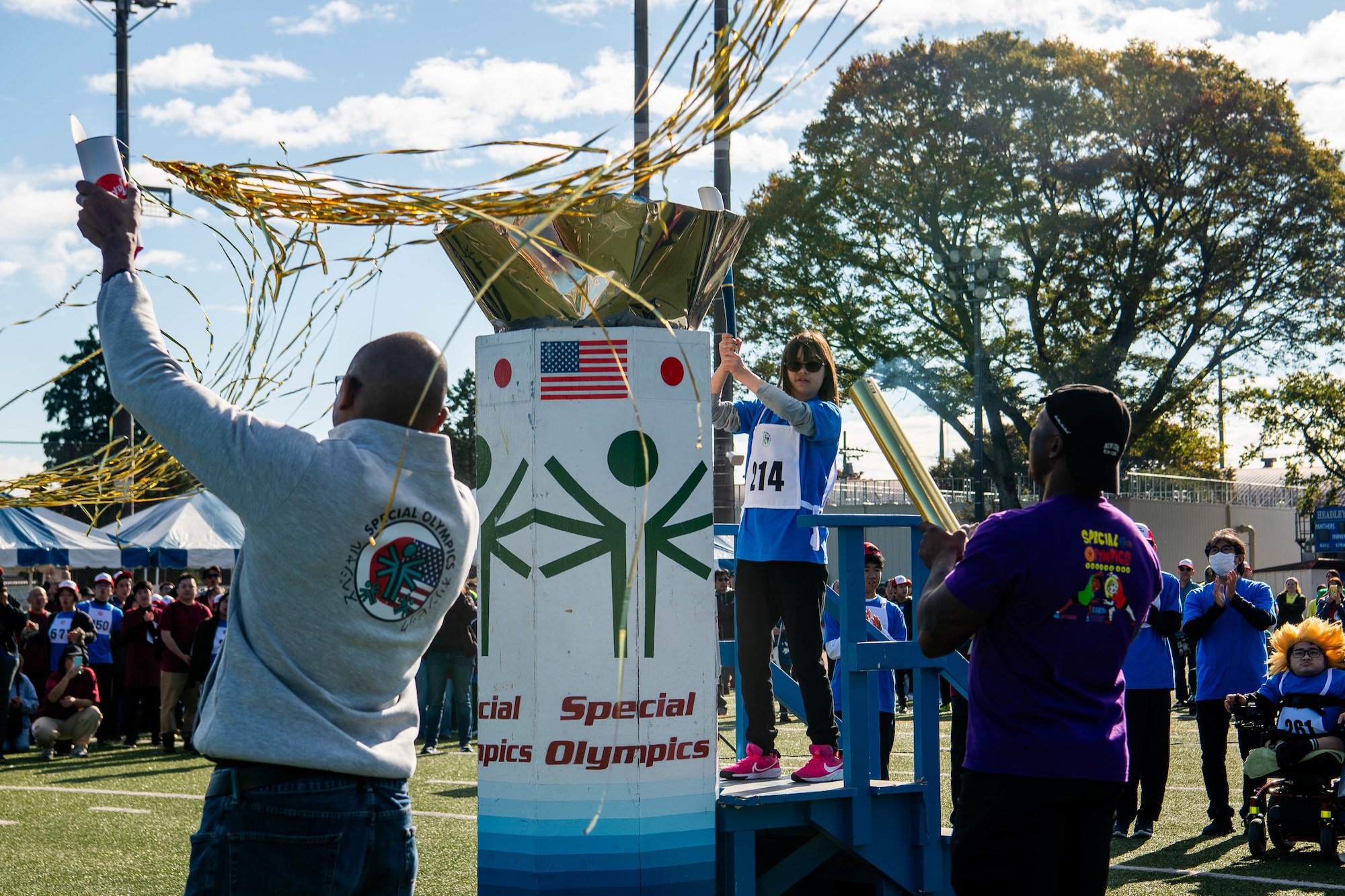 Participating athletes light the ceremonial torch.