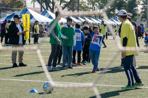 Athletes participate in a soccer shoot competition.