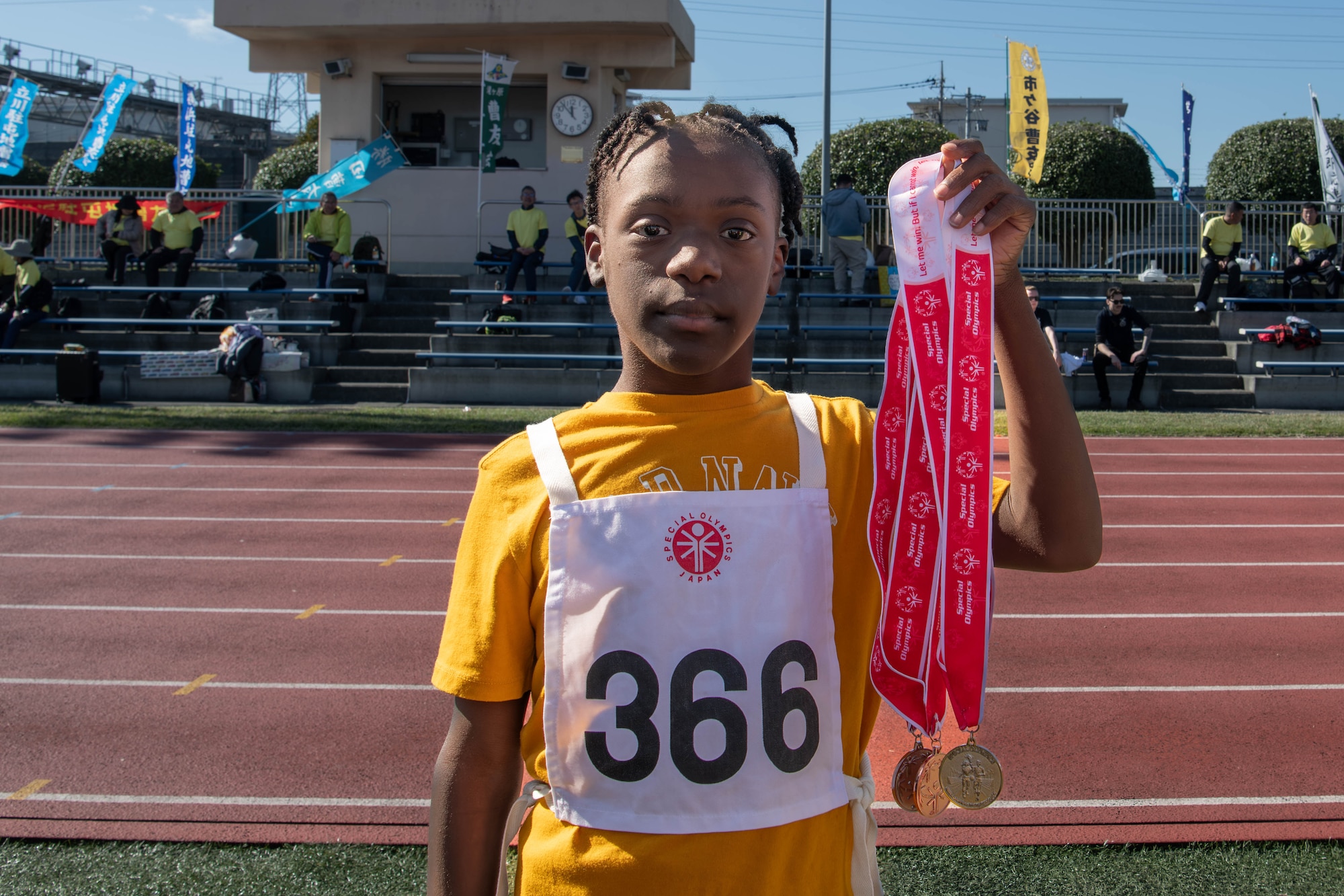 Braden Gates, Yokota Middle School student, displays his medals won.