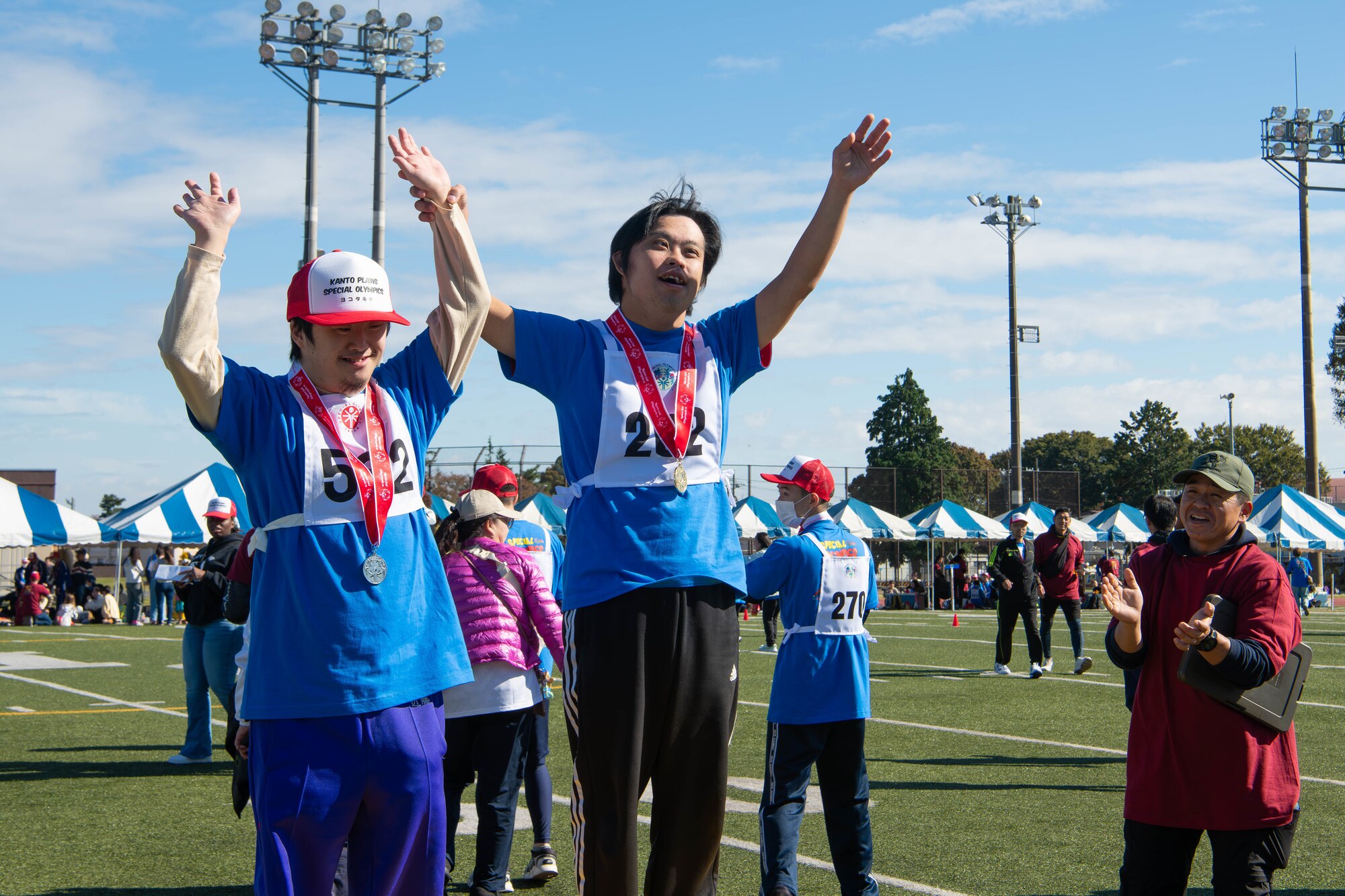 Athletes celebrate after receiving their medals.