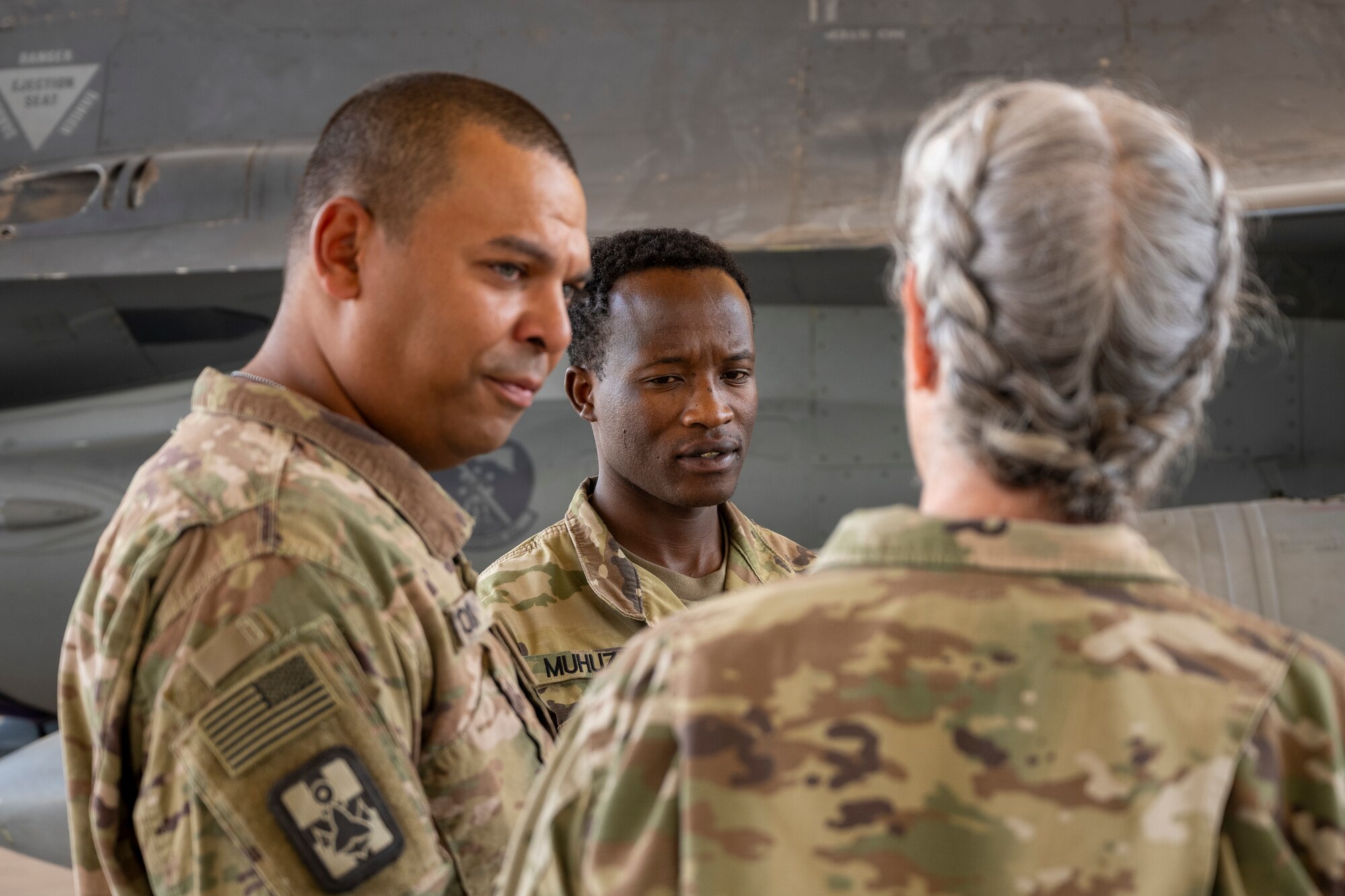 U.S. Army Sgt. Aimable Muhuza, 401st Medical Logistics Company medical logistics manager, waits in front of an F-16 Fighting Falcon before his promotion ceremony in the U.S. Central Command area of responsibility, Oct. 22, 2024.