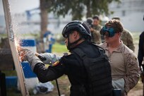 U.S. Marine Corps Sgt. Andrew Donahue, right, 2336 Explosive Ordnance Disposal (EOD) Technician, 8th Engineer Support Battalion, 2d Marine Logistics Group, conducts exothermic breaching training with a member of the Moroccan Navy Special Forces as part of exercise Phoenix Express 2024 in Bizerte, Tunisia, Nov. 6, 2024.
