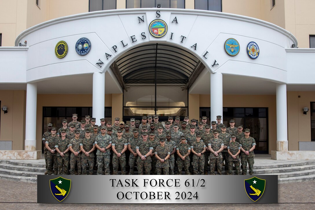 U.S. Marines and Sailors with Task Force 61/2 pose for a group photo at Naval Support Activity, Naples, Italy, Oct. 10, 2024. Task Force 61/2's synchronized command and control of assigned forces and seamless integration with U.S. Naval Forces Europe-Africa, U.S. Sixth Fleet and U.S. Marine Corps Forces Europe and Africa directly supports regional readiness, crisis response, and deterrence in the U.S. European Command and U.S. Africa Command area of operations. (U.S. Marine Corps photo by Cpl. Marc Imprevert)