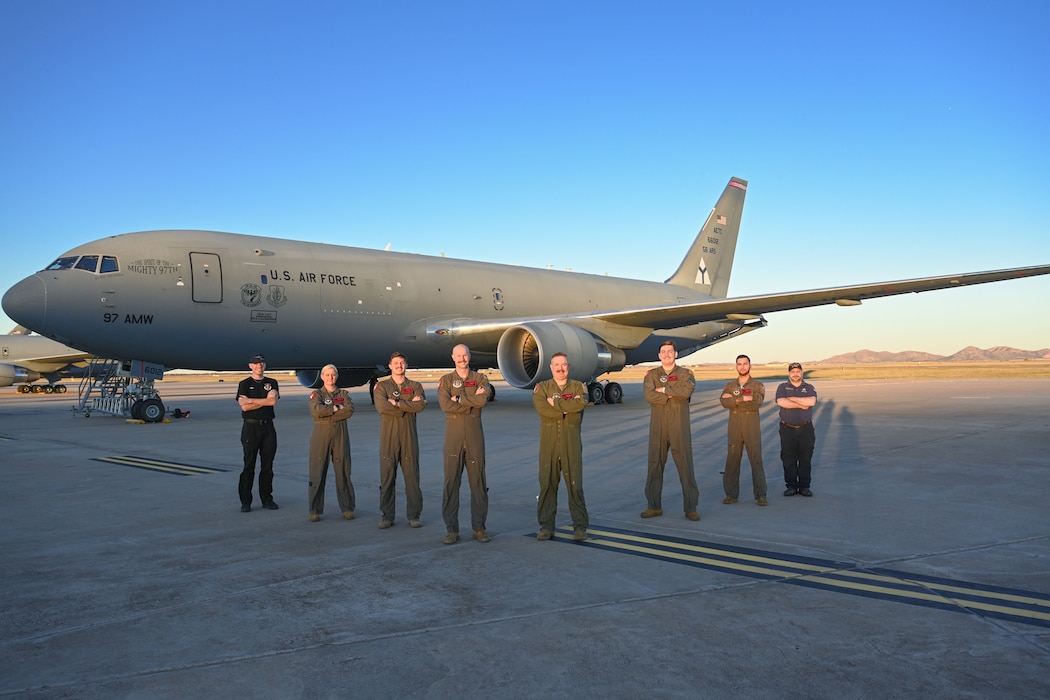 The 56th Air Refueling Squadron’s KC-46 Pegasus demo team and members from the 97th Aircraft Maintenance Squadron pose for a photo at Altus Air Force Base, Oklahoma, Nov. 9, 2024. From left to right, the team consists of Thomas Turner, engine mechanic, Tech. Sgt. Lacy Pickett, boom operator, Staff Sgt. Braydon Scarborough, boom operator, Maj. Brian Weeks, pilot, Maj. Gary Sowa, pilot, Capt. Jeremy Delzer, pilot, Staff Sgt. AJ Gac, boom operator, and William Guenther, avionics technician. (U.S. Air Force photo by Airman 1st Class Jonah Bliss)