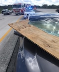 A piece of plywood flew off a truck and smashed through this car’s windshield on Interstate 95 near Rockledge, Fla., but miraculously, no one was injured. Unsecured items can become lethal flying debris when driving, especially at higher speeds on highways.