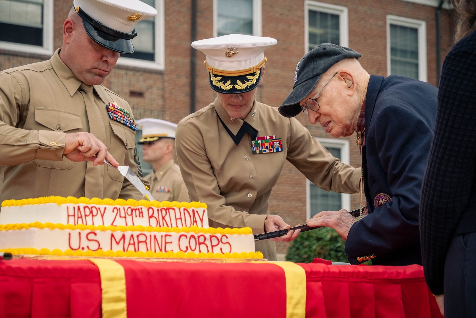 Retired U.S. Marine Corps Col. Frank Harris III, right, cuts the cake with Col. Jenny Colegate, base commander of Marine Corps Base Quantico, during the Marine Corps cake cutting ceremony in honor of the 249th Marine Corps birthday on MCBQ, Virginia, Nov. 7, 2024. The ceremony honors the oldest and youngest Marine in attendance, representing the passing of tradition between generations of Marines; Harris is the oldest Marine who is currently 100 years old. The annual celebration is a long-standing tradition which celebrates the establishment of the United States Marine Corps on Nov. 10, 1775 and honors the service and sacrifice of all Marines, past and present. (U.S. Marine Corps photo by Lance Cpl. Joaquin Dela Torre)