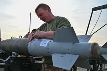British Royal Air Force (RAF) Squadron Leader Hugh McCluskie assembles a bomb during the Air Force Combat Ammunition Center’s Senior Officer Orientation (SOO) course on Beale Air Force Base, California, Nov. 5, 2024