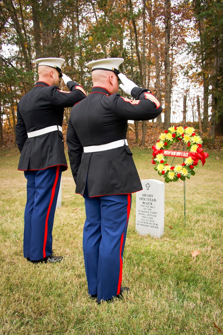 U.S. Marine Corps Gunnery Sgt. Richard M. Kennedy, the staff non-commissioned officer in charge of Marine Corps Base Quantico’s Ceremonial Platoon, left, and Sgt. Maj. Michael Brown, the Sergeant Major of Marine Corps Base Quantico, salute during a wreath laying ceremony at Quantico National Cemetery, Triangle, Virginia, Nov. 10, 2024. This wreath laying ceremony honored U.S. Marine Corps Sgt. Maj. Henry Black, the seventh Sergeant Major of the Marine Corps. Sgt. Maj. Black served in active duty from 1948 all the way through 1977; during his time in service he fought in the Korean war and Vietnam war, earning both the Silver and Bronze Star Medal as well as the Legion of Merit Medal. (U.S. Marine Corps courtesy photo by Sgt. Abrianna Rodriguez)